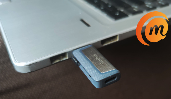 SanDisk Ultra Dual Drive flash drive plugged into laptop