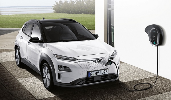 Hyundai Kona electric car and charging station